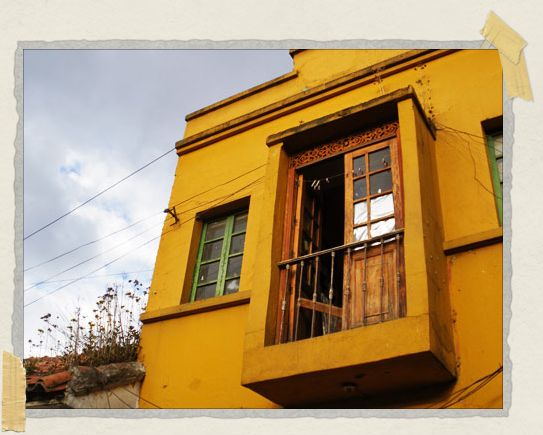 In the Candeleria neighborhood, many of the colonial buildings were painted in bright yellows, blues, greens, and reds 'In the Candeleria neighborhood, many of the colonial buildings were painted in bright yellows, blues, greens, and reds
