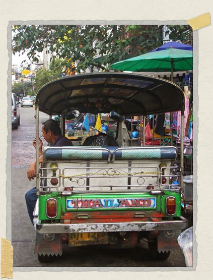 A tuk-tuk (basically a golf cart on steroids) driver waits for his next customer 'A tuk-tuk (basically a golf cart on steroids) driver waits for his next customer